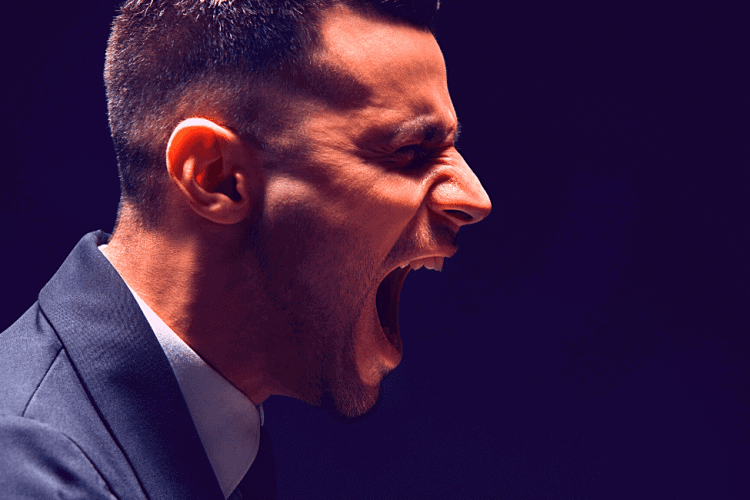 A man in a suit screaming with a black background